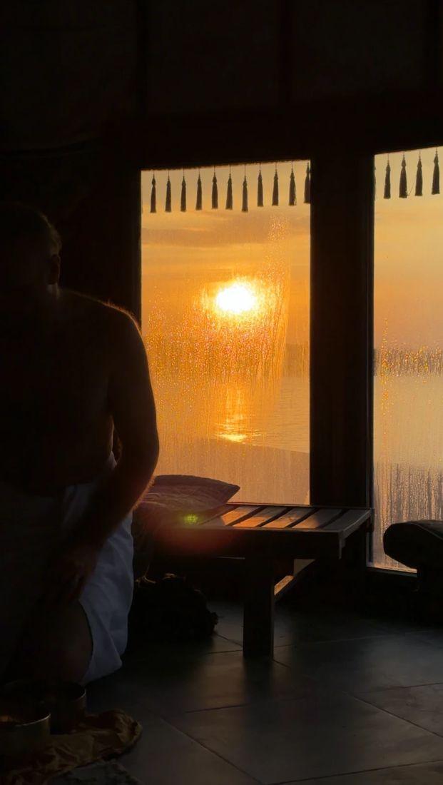 Banya lounge at sunset, windows to the lake