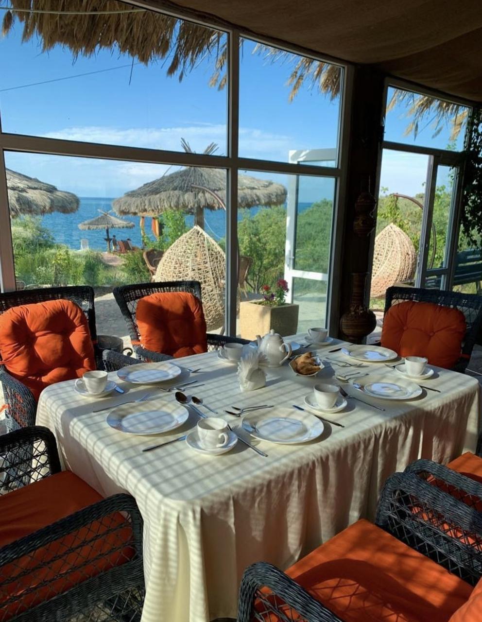 Breakfast by a window with a lake view