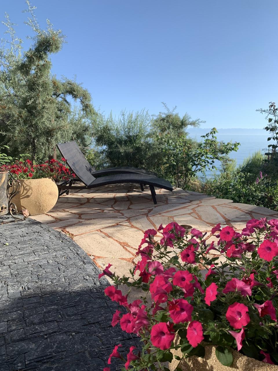 Terrace with flowers above the lake