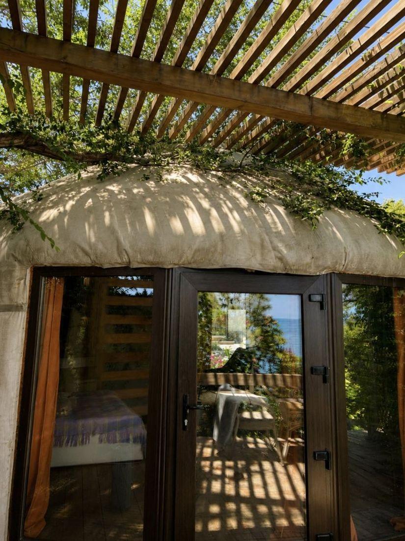Ethno-House entrance under the pergola