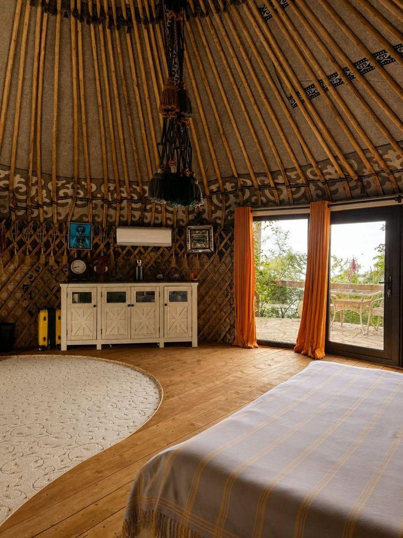 Ethno-House bedroom with a garden window
